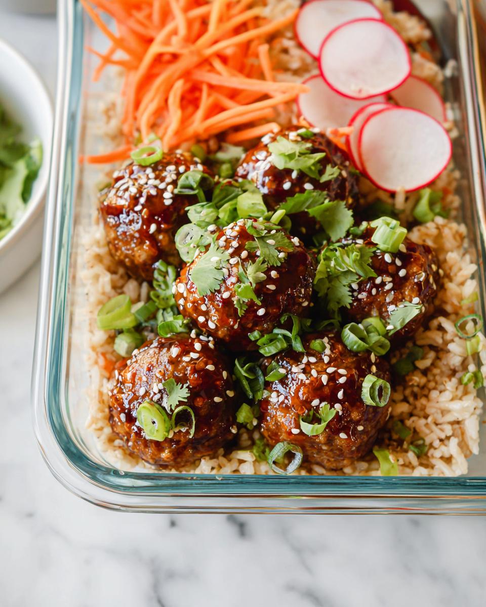 Maple-Sriracha cocktail meatballs served over rice with carrots and radishes.